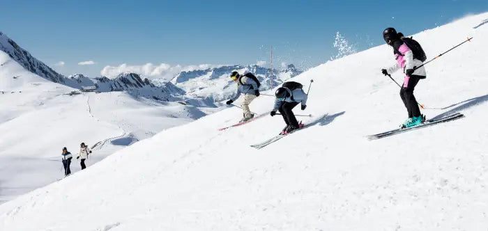 Skiers on an all mountain run