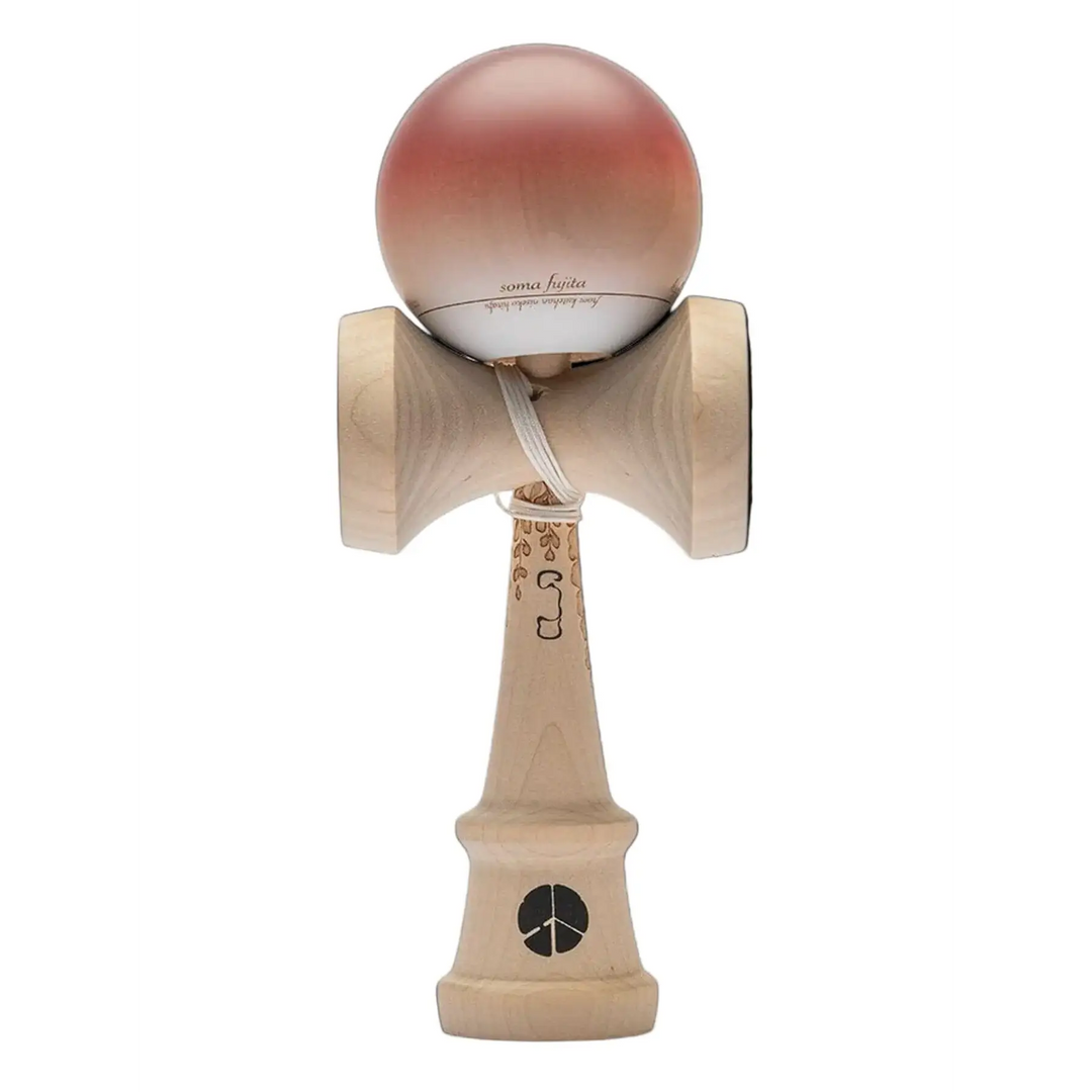 Wooden kendama toy with pink ball on a black background