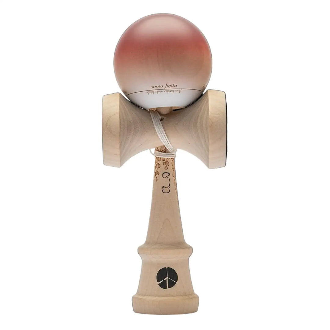 Wooden kendama toy with pink ball on a black background