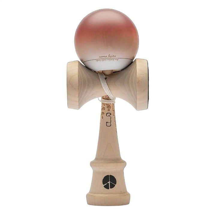 Wooden kendama toy with pink ball on a black background